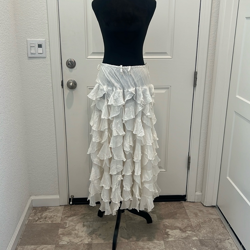 Great condition 100% silk tiered skirt.  Elastic waist.  12” waist, 34.5” length
